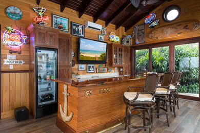 Design ideas for a traditional home bar in Miami.