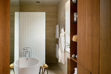 Inspiration for a large modern master limestone floor walk-in shower remodel in New York with medium tone wood cabinets