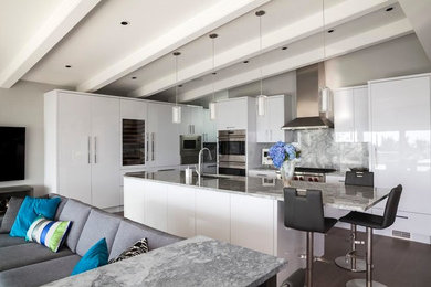 Mid-sized transitional u-shaped eat-in kitchen in Vancouver with a single-bowl sink, flat-panel cabinets, white cabinets, granite benchtops, grey splashback, stone slab splashback, panelled appliances, dark hardwood floors and with island.