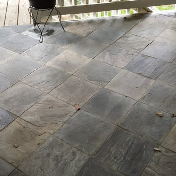 Uneven slate tile and cracked grout joints all over - before