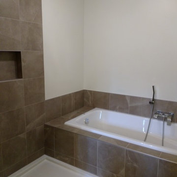 Enlarge bathroom, convert bedroom closet into bathroom shower. Full remodel.
