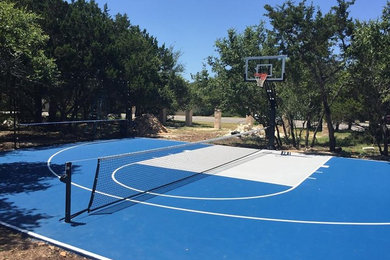 Photo of a mid-sized traditional partial sun backyard concrete paver landscaping in Austin for summer.