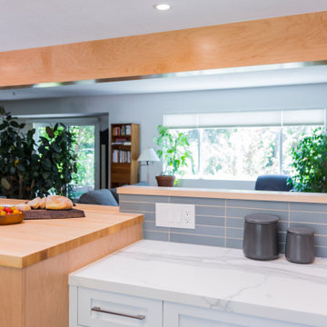 Maple Wrapped Exposed Beam Between Kitchen and the Living Area