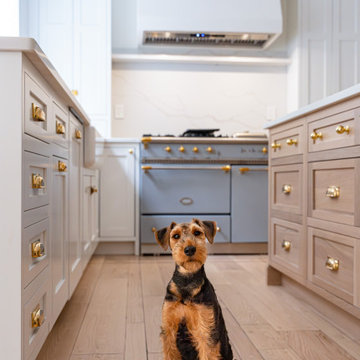 Château Charm: French-Inspired Kitchen Renovation with Plaster Hood Blue Stove a