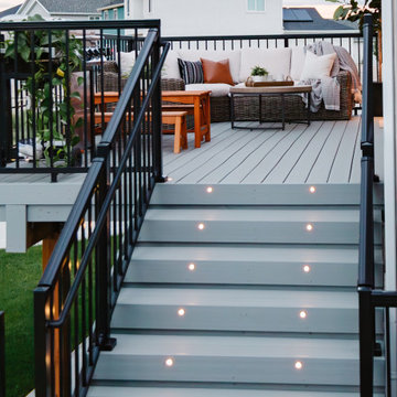 Stairs Leading from Deck to Concrete Patio and Lawn
