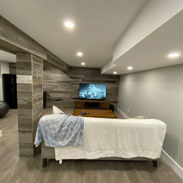 Basement renovation with reclaimed barn wood feature