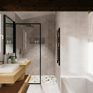 Immagine di una stanza da bagno padronale industriale con vasca da incasso, doccia a filo pavimento, piastrelle bianche, piastrelle di vetro, pavimento in cemento, lavabo da incasso, pavimento grigio, doccia aperta, nicchia e due lavabi