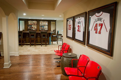 Example of a large classic underground medium tone wood floor basement design in Atlanta with beige walls