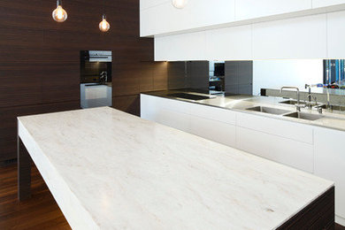 This is an example of a kitchen in Sydney with solid surface benchtops.