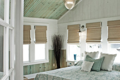 Inspiration for a beach style master bedroom in DC Metro with multi-coloured walls and light hardwood floors.