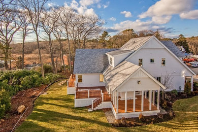Large elegant white three-story wood gable roof photo in Boston