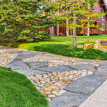 Flagstone Driveway With Rock Feature