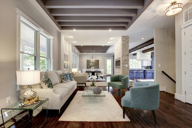 Example of a mid-sized transitional formal and open concept dark wood floor and brown floor living room design in DC Metro with beige walls and no tv