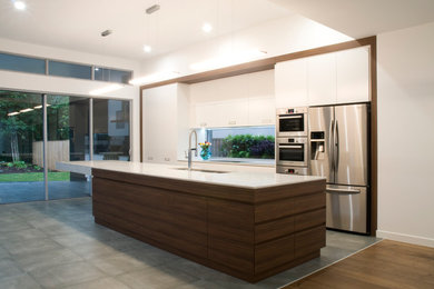 Inspiration for a modern kitchen in Sunshine Coast with quartz benchtops and with island.