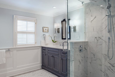Corner shower - mid-sized contemporary master multicolored tile and porcelain tile porcelain tile, multicolored floor, single-sink and wood wall corner shower idea in Other with recessed-panel cabinets, a two-piece toilet, blue walls, an integrated sink, quartz countertops, a hinged shower door, white countertops, a built-in vanity and dark wood cabinets