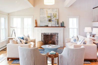 Living room - mid-sized traditional open concept light wood floor living room idea in Boston with white walls, a standard fireplace, a stone fireplace and no tv