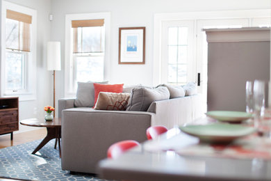 Family room - large transitional enclosed medium tone wood floor family room idea in Minneapolis with gray walls, no fireplace and no tv