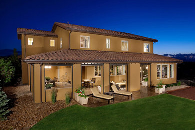 This is an example of a mid-sized transitional partial sun backyard concrete paver outdoor basketball/tennis/multi-game court in Denver for spring.