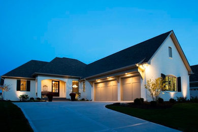 Transitional one-storey brick white exterior in Indianapolis.