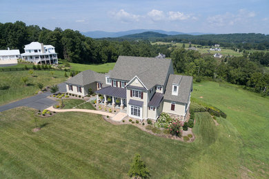 Inspiration for a large craftsman gray two-story mixed siding exterior home remodel in Other with a shingle roof