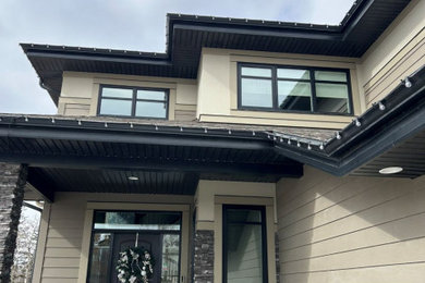 Large trendy home design photo in Edmonton