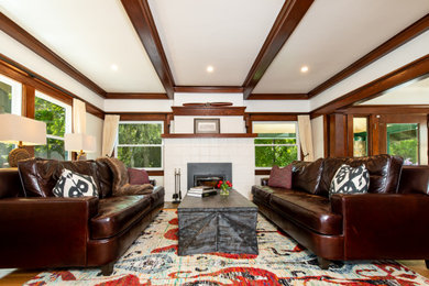 Living room - large craftsman formal and enclosed medium tone wood floor and exposed beam living room idea in San Francisco with white walls, a standard fireplace, a tile fireplace and no tv