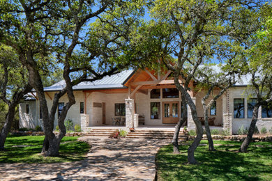 Example of a country exterior home design in Other