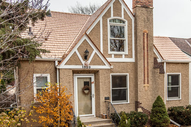 Example of a mid-sized classic home design design in Minneapolis