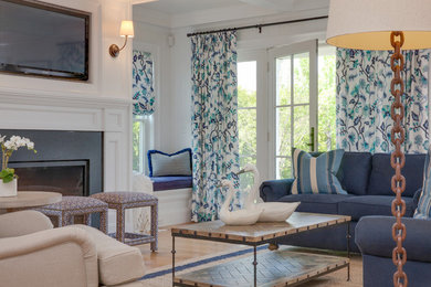Example of a large beach style formal and open concept light wood floor and beige floor living room design in Boston with white walls, a standard fireplace, a stone fireplace and a wall-mounted tv