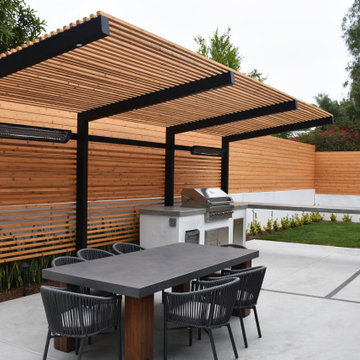 Coastal Modern Landscape with Custom Spa, Fire Feature, Pergola, & BBQ/Bar