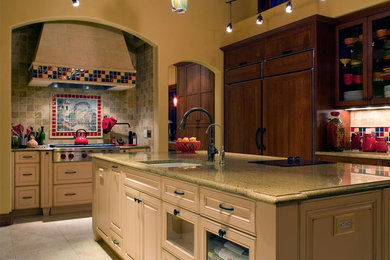 Large eclectic galley porcelain tile eat-in kitchen photo in Austin with an undermount sink, recessed-panel cabinets, medium tone wood cabinets, granite countertops, multicolored backsplash and paneled appliances