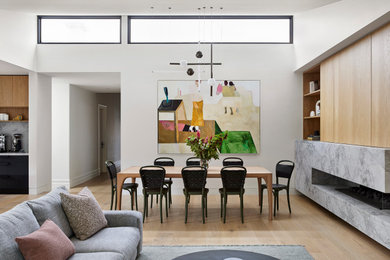 This is an example of a large contemporary dining room in Melbourne.