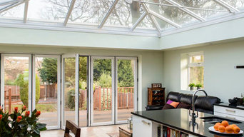 Orangery with glass roof and brick pillars