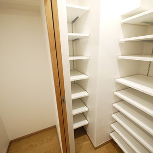 Farmhouse kitchen pantry ideas - Country medium tone wood floor kitchen pantry photo in Tokyo