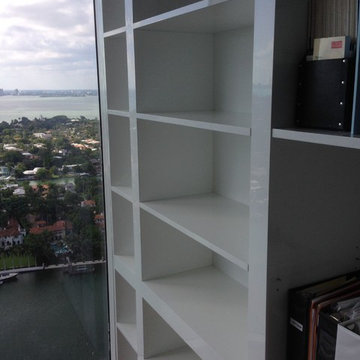 Acrylic wall unit with pivoting section to hide master bedroom
