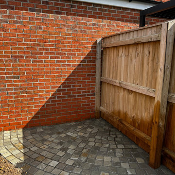 Sett Circle Bedded Into a Corner Against Brickwork