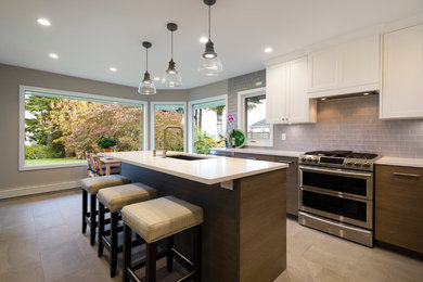 Kitchen pantry - mid-sized contemporary ceramic tile and beige floor kitchen pantry idea in Vancouver with an undermount sink, flat-panel cabinets, medium tone wood cabinets, quartz countertops, beige backsplash, ceramic backsplash, stainless steel appliances and an island