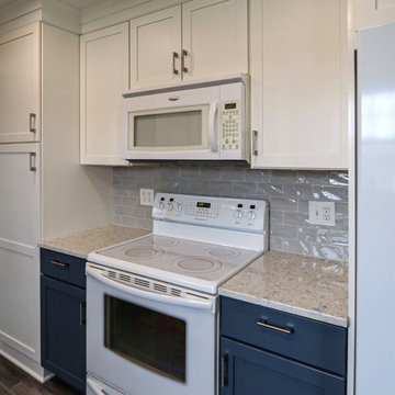 Two-Tone White & Blue Kitchen with Smoke Stained Quartz Countertops
