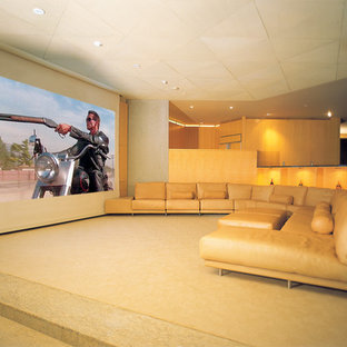 Design ideas for an expansive modern open plan home cinema in Hawaii with limestone flooring and a projector screen.