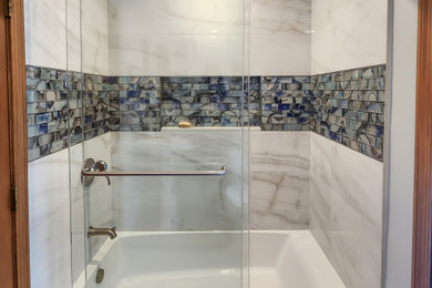 Example of a small transitional master multicolored tile and porcelain tile porcelain tile and gray floor bathroom design in Boston with gray walls and a niche