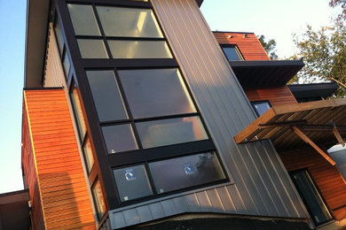 Large contemporary three-story mixed siding exterior home idea in DC Metro