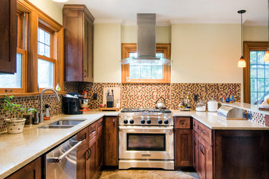 Mid-sized arts and crafts u-shaped ceramic tile eat-in kitchen photo in Columbus with an undermount sink, flat-panel cabinets, medium tone wood cabinets, quartz countertops, multicolored backsplash, mosaic tile backsplash, stainless steel appliances and a peninsula