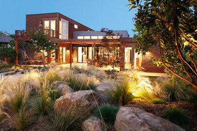 This is an example of a large modern backyard full sun xeriscape in Santa Barbara with gravel.
