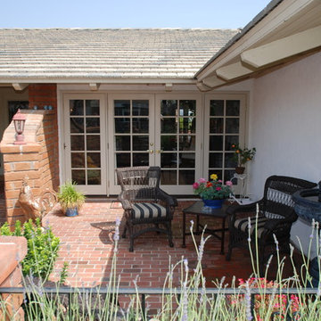 Garden Sunroom With Trompe-l'oeil Painting Walls & Trellis Over Mirror