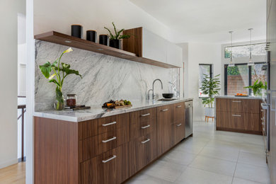 Small minimalist galley porcelain tile and gray floor eat-in kitchen photo in San Francisco with an undermount sink, flat-panel cabinets, medium tone wood cabinets, marble countertops, gray backsplash, marble backsplash, stainless steel appliances, a peninsula and gray countertops