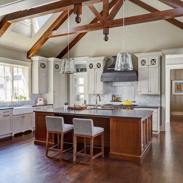 Large Kitchen with White and Cherry Cabinets and Beamed Ceiling