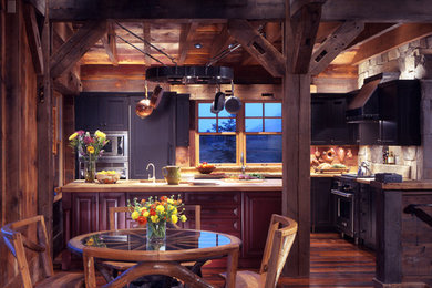Inspiration for a rustic l-shaped medium tone wood floor open concept kitchen remodel in Denver with shaker cabinets, distressed cabinets and an island
