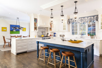 Inspiration for a large country u-shaped dark wood floor and brown floor kitchen remodel in Boston with an undermount sink, recessed-panel cabinets, white cabinets, marble countertops, stainless steel appliances, an island, gray backsplash and mosaic tile backsplash