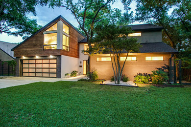 Contemporary two-story mixed siding house exterior idea in Denver with a shed roof and a shingle roof