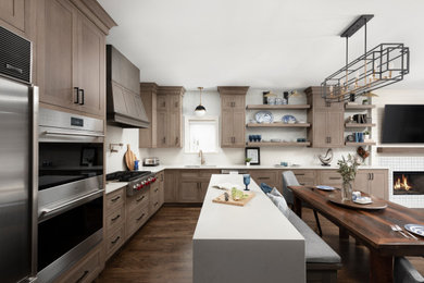 Inspiration for a mid-sized contemporary medium tone wood floor and brown floor open concept kitchen remodel in Chicago with an undermount sink, shaker cabinets, light wood cabinets, quartz countertops, beige backsplash, quartz backsplash, stainless steel appliances, an island and beige countertops